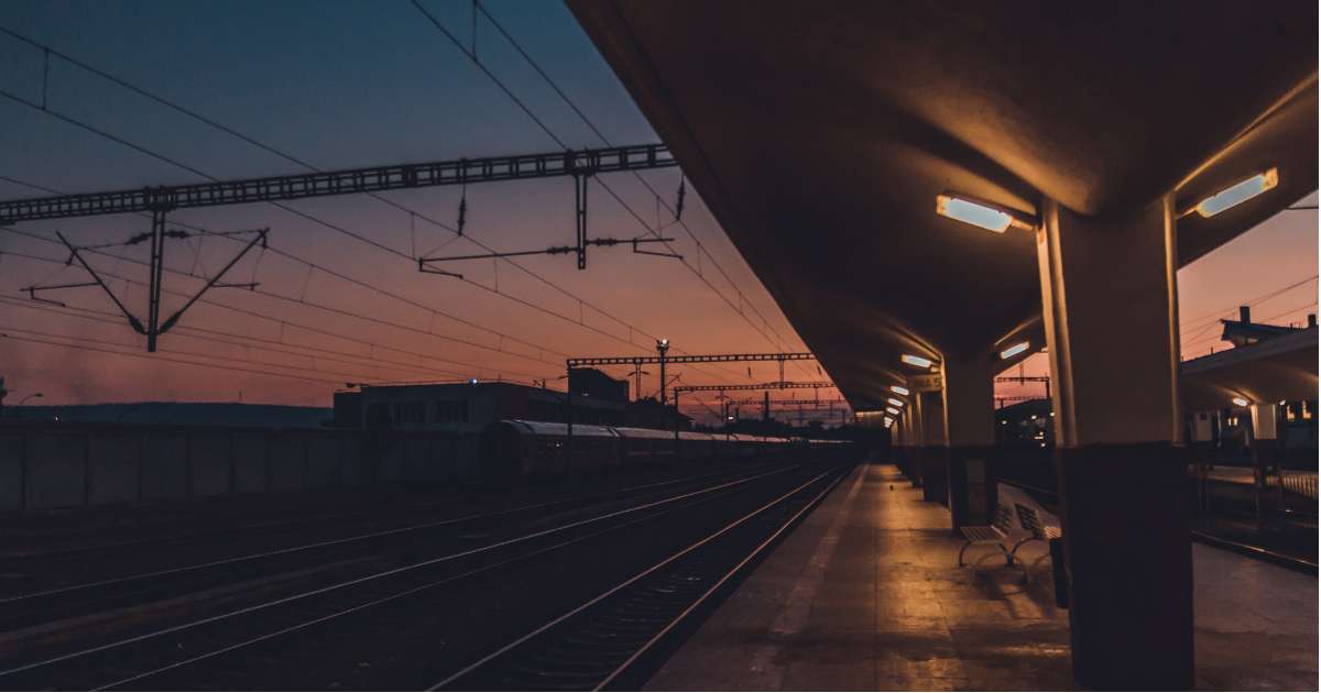 1. High speed railway tracks and platform illuminated at sunset