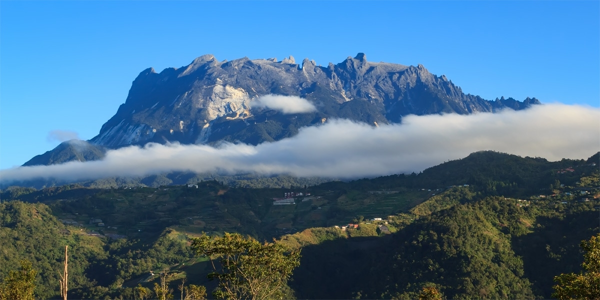 Mount kinabalu in the distance over the clouds