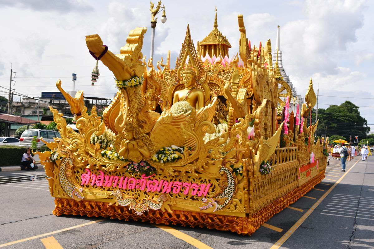 A float of a giant golden statue during the Buddhist month of Lent