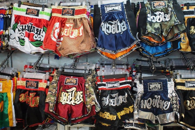 a bunch of muay thai shorts