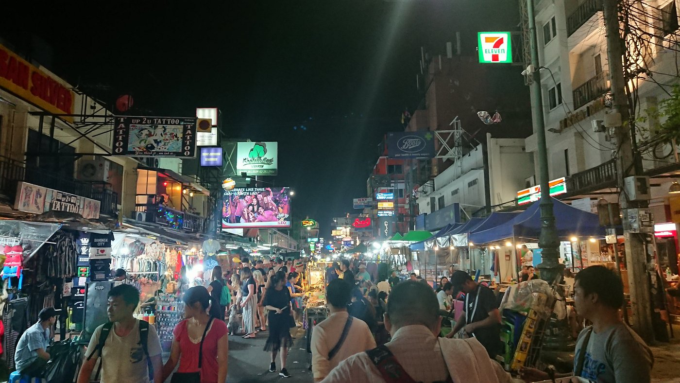 Streets of Bangkok at night hustling and bustling with food, drinks and entertainment