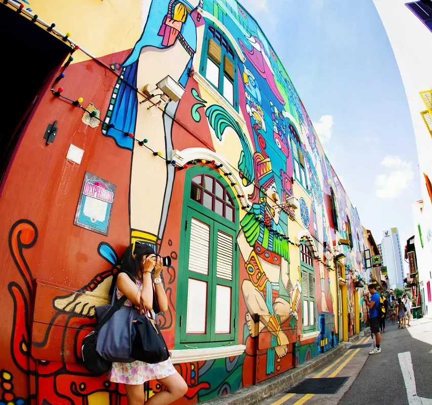 A tourist taking pictures in haji lane singapore