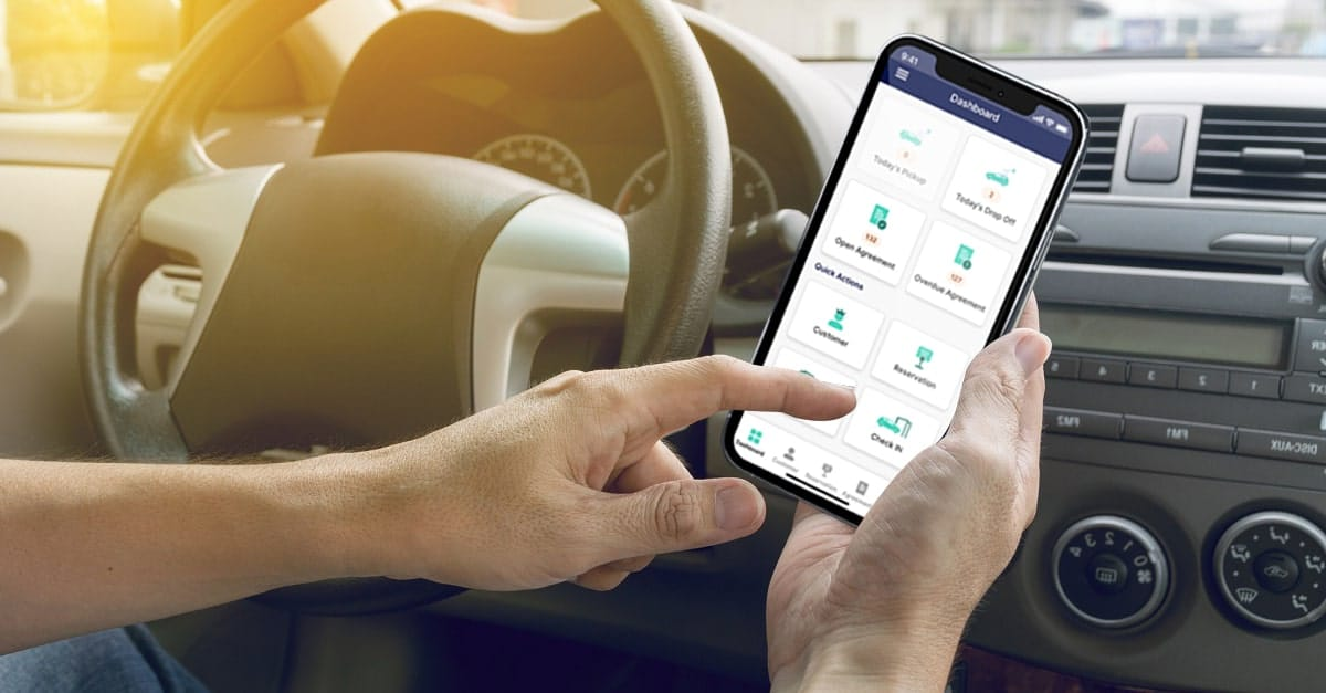 A person utilizing an app on their phone in their car