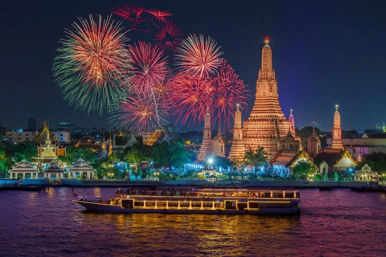 Christmas in Bangkok where the fireworks are going off non-stop, lighting up the night sky