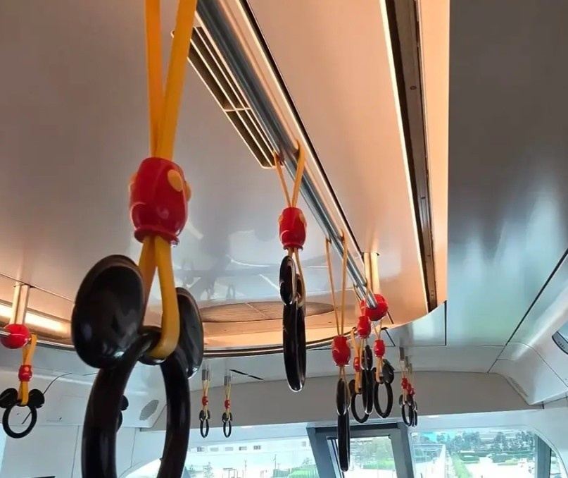 Mickey Mouse hand straps inside the Disney Resort Line monorail in Tokyo