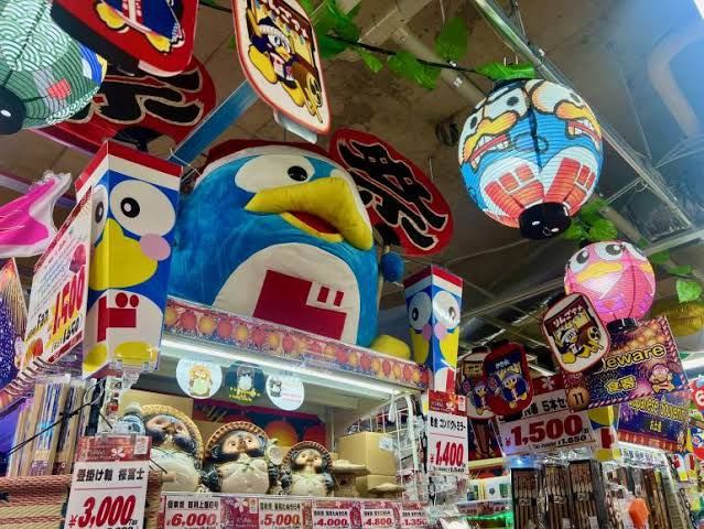 Donpen mascot merchandise inside a Japanese discount store, Donki