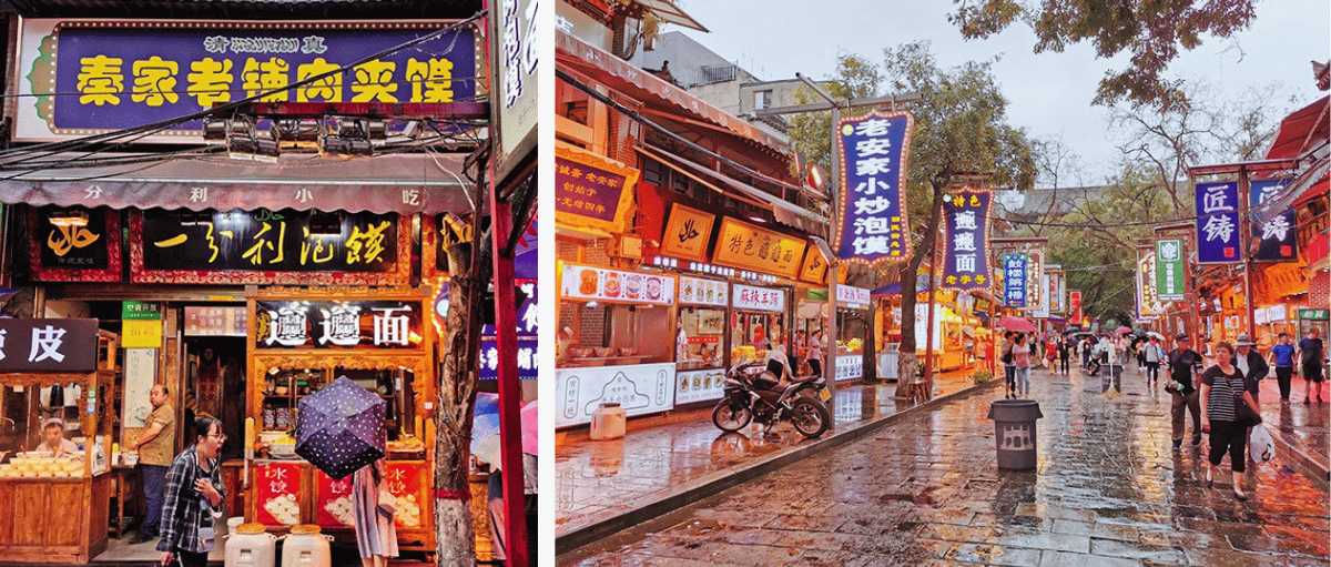 Zona comercial con restaurantes y carteles chinos iluminados, calles gastronómicas en Xi’an