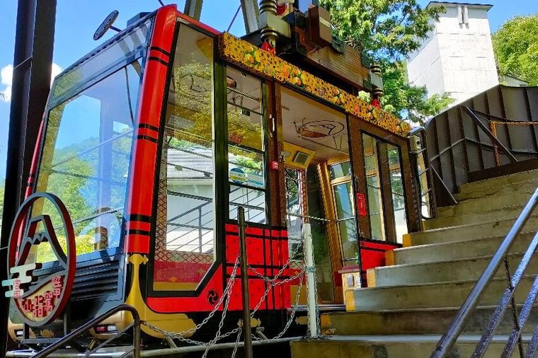 Mt. Fuji Panoramic Ropeway with a red cable car above Lake Kawaguchi
