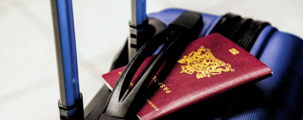 Passport placed on a suitcase, ready for an international trip to Vietnam