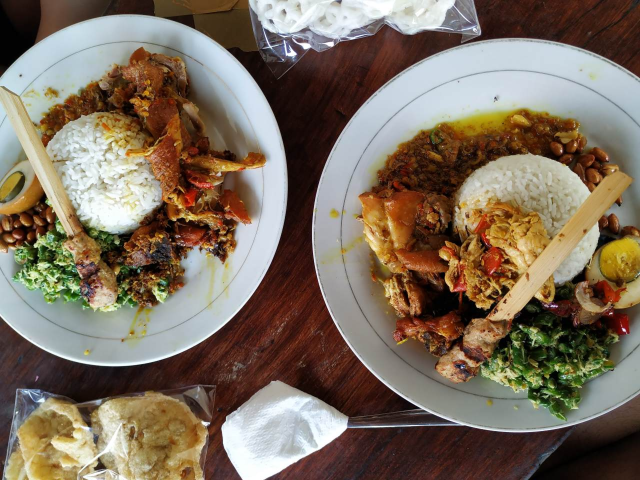 Two plates of nasi campur
