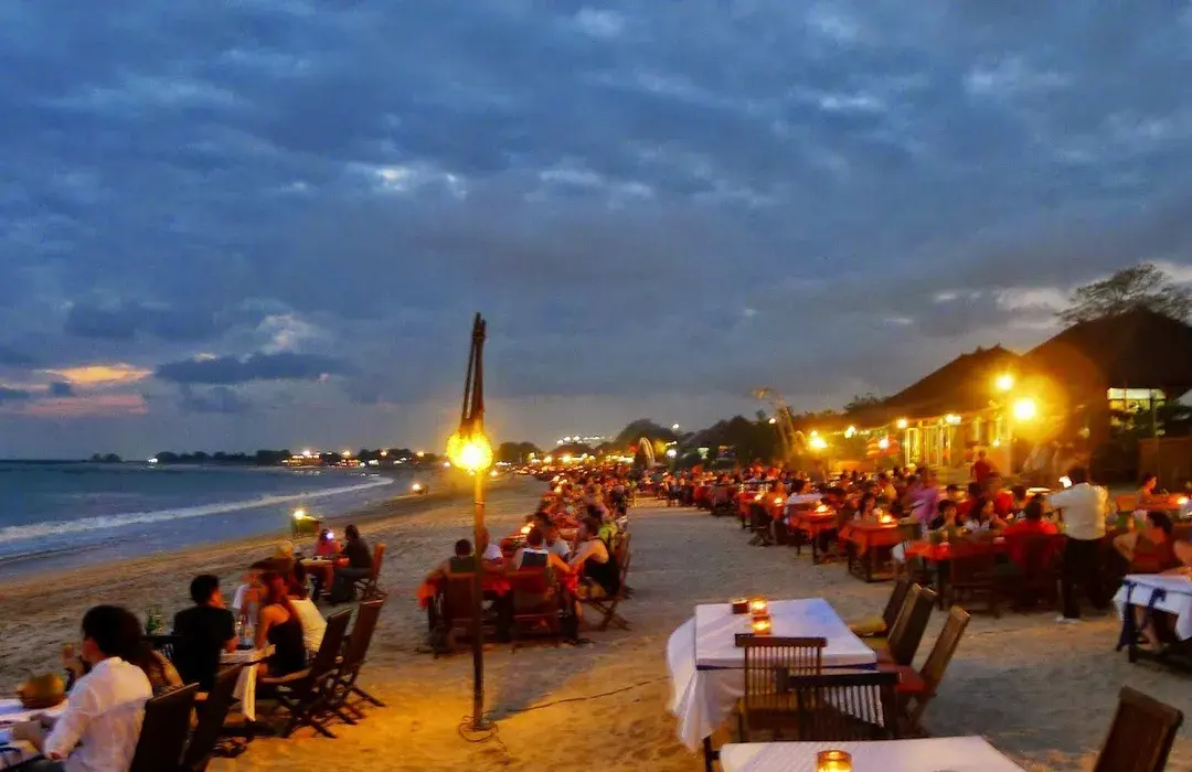 tourist chilling by the beach at night