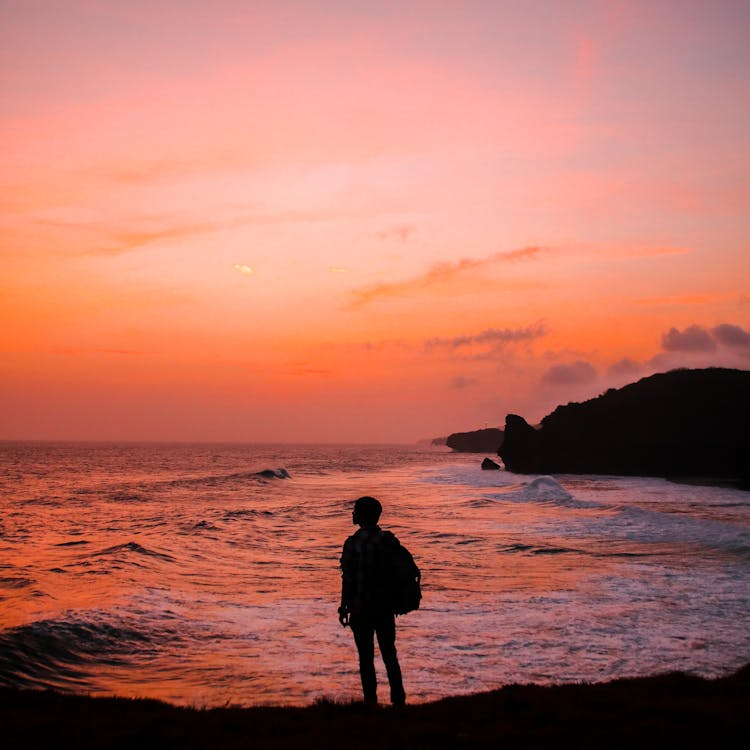 A man walking by the beach