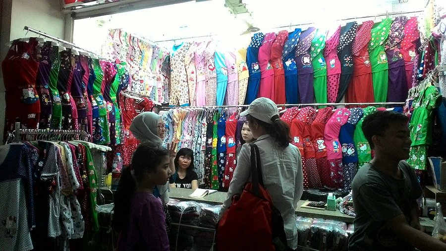 A group of ladies buying a hijab from a store