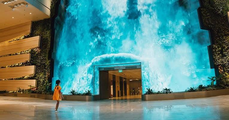 Indoor waterfall-themed digital ceiling at Singapore Changi Airport