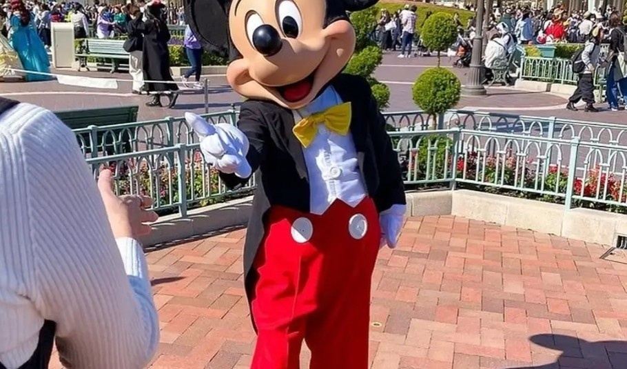 Mickey Mouse greeting guests at Tokyo Disneyland