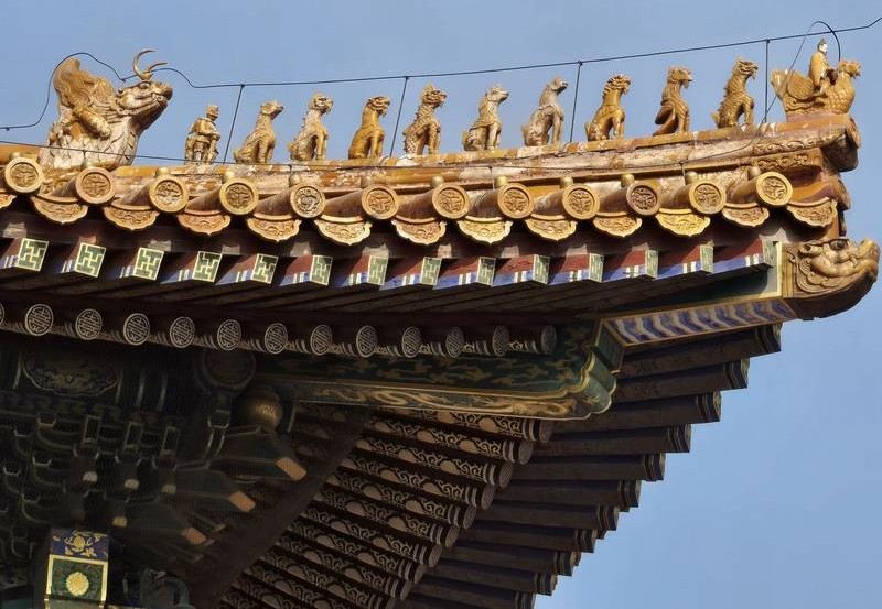 Ornate traditional Chinese roof with decorative figures and carvings