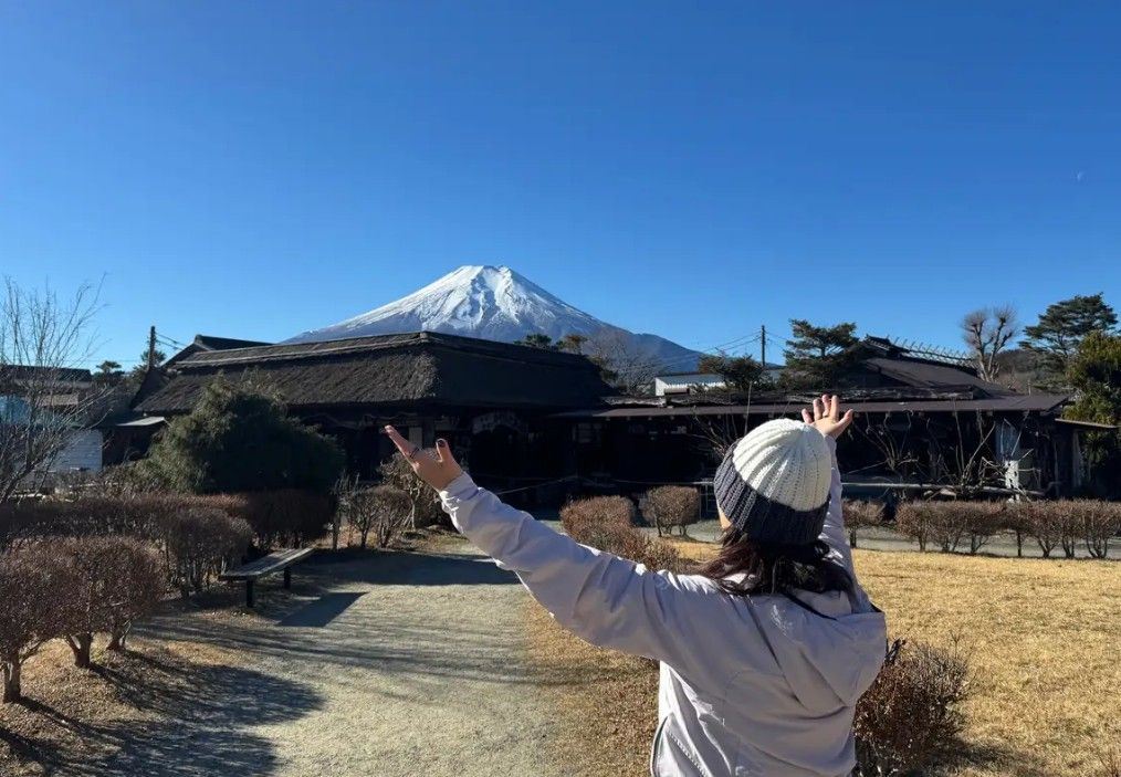 Traveler looking at Majestic Mount Fuji in a Clear sky