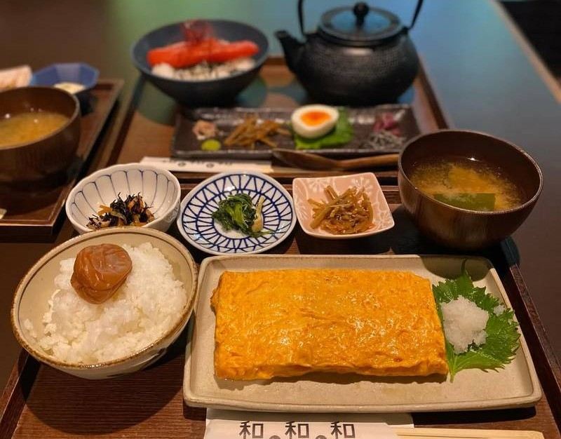 Japanese set meal served with tempura, sashimi, rice, and side dishes