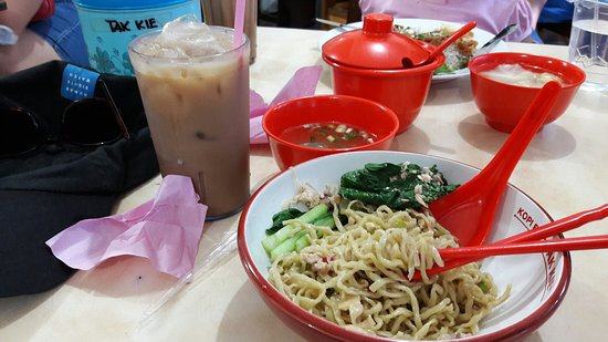 A bowl of noodles and some traditional coffee