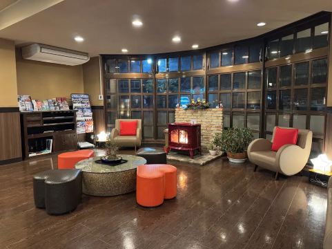 Cozy hotel lobby with fireplace and seating near Lake Kawaguchi