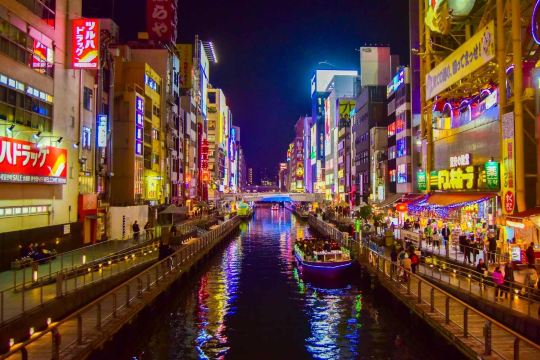 Don Quijote Dotonbori glowing beside the canal at night