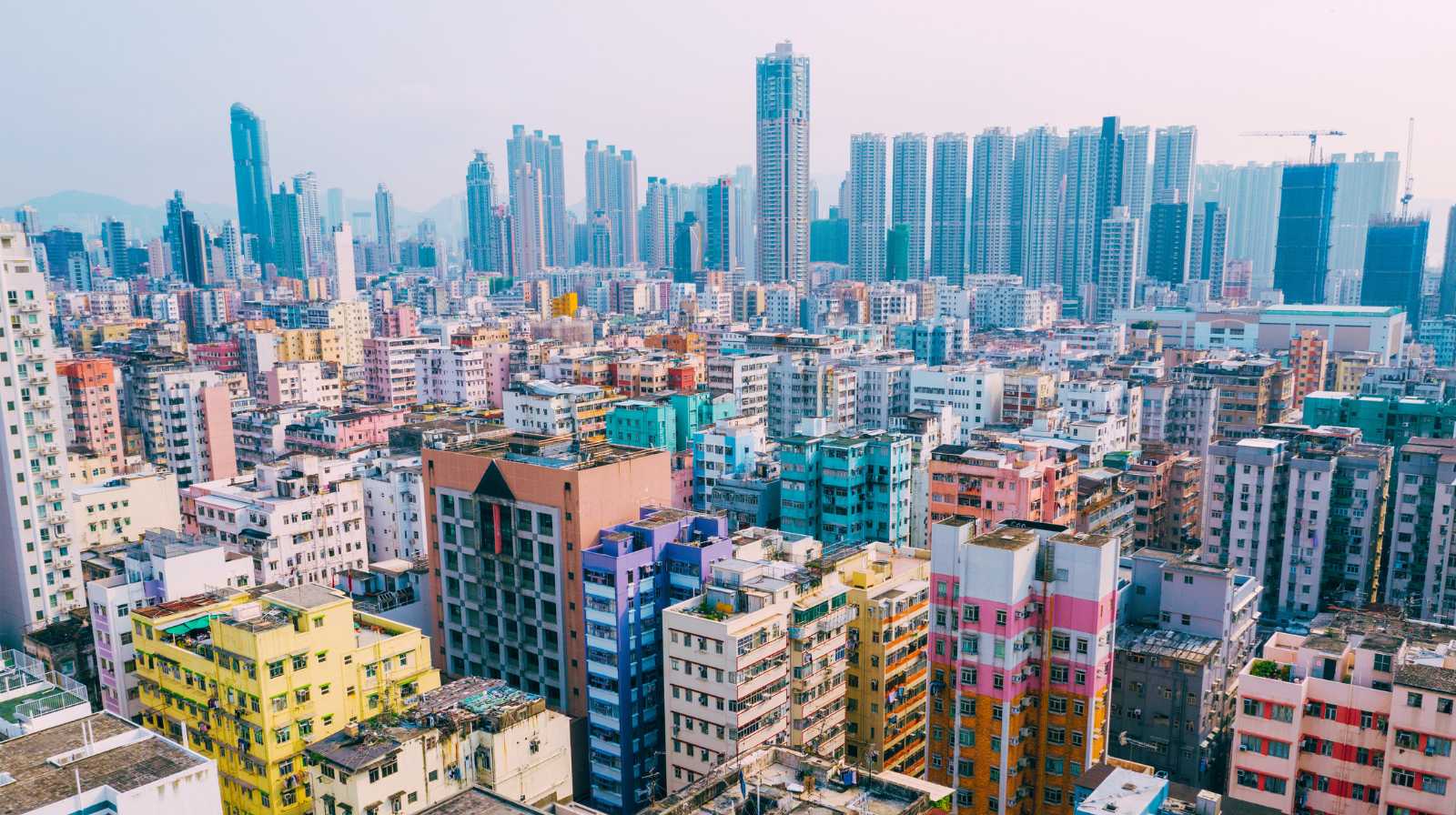Panoramic view of Hong Kong with a blend of modern skyscrapers and colourful residential buildings