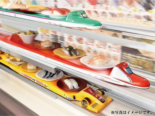 Sushi being delivered by a toy train