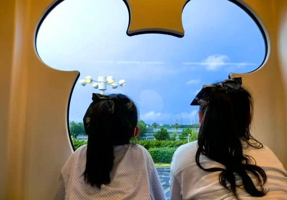 View through a Mickey-shaped window inside the Disney Resort Line monorail