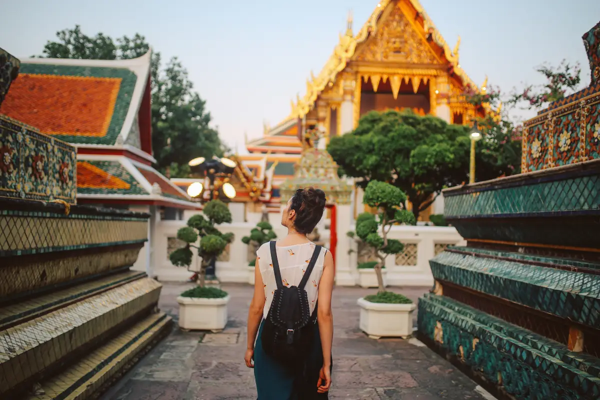 A tourist walking along temple walls