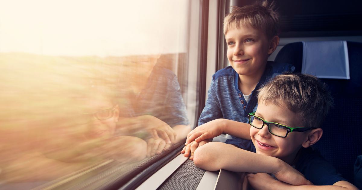 Children looking through a train window