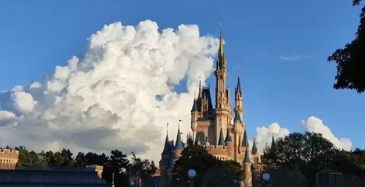 Cinderella Castle standing tall at Tokyo Disneyland on a sunny day
