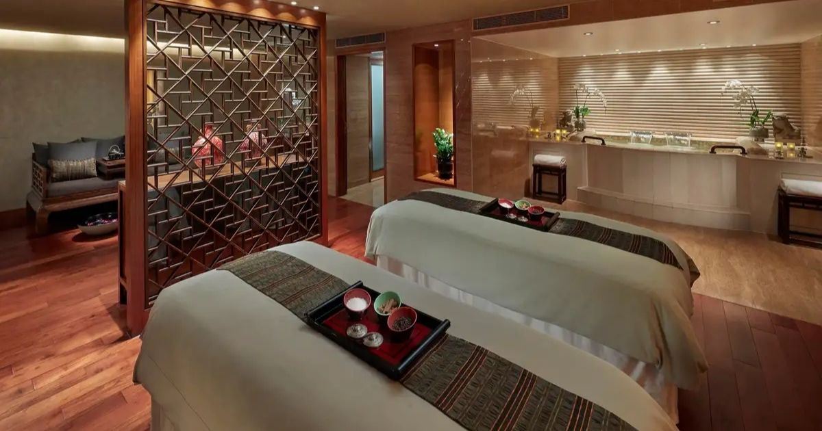 Double massage room in a luxury spa in Hong Kong with two beds and elegant decor