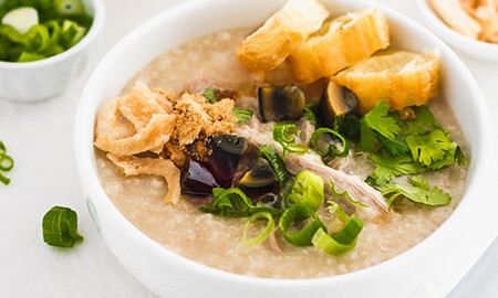 Shanghai-style savory rice porridge, xian zhou, topped with century egg, pidan