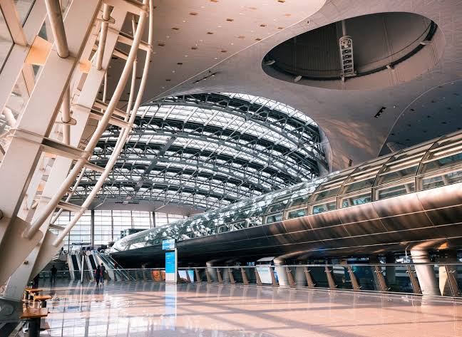 Incheon International Airport’s illuminated terminal complex at night.