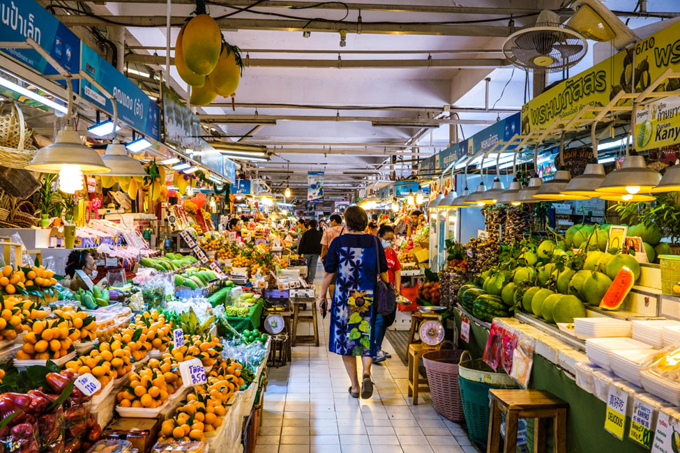 A tourist walking through a market