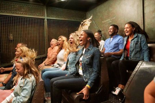 Guests experiencing a thrilling ride inside Disney's Hollywood Studios
