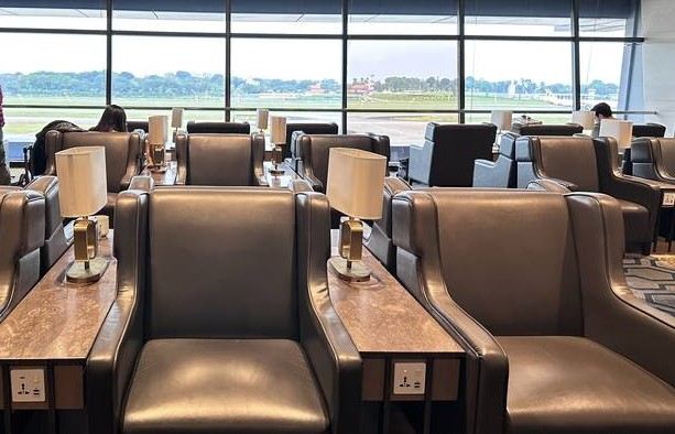 Comfortable airport lounge seating overlooking the runway