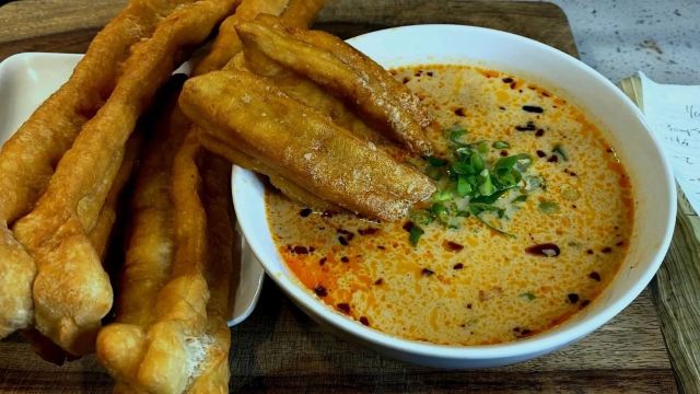 Fried dough sticks, youtiao, served with savory soy milk, xian doujiang