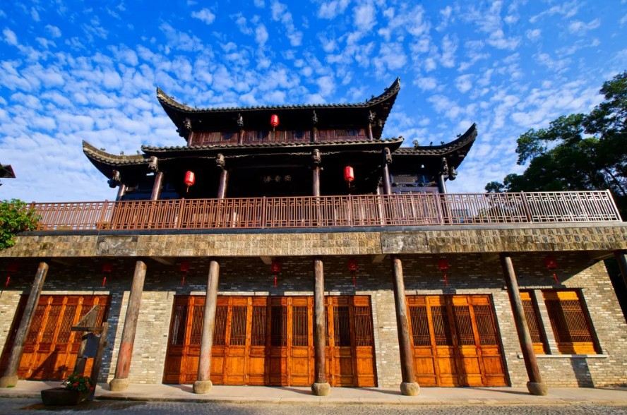 Traditional Chinese building with wooden doors and red lanterns