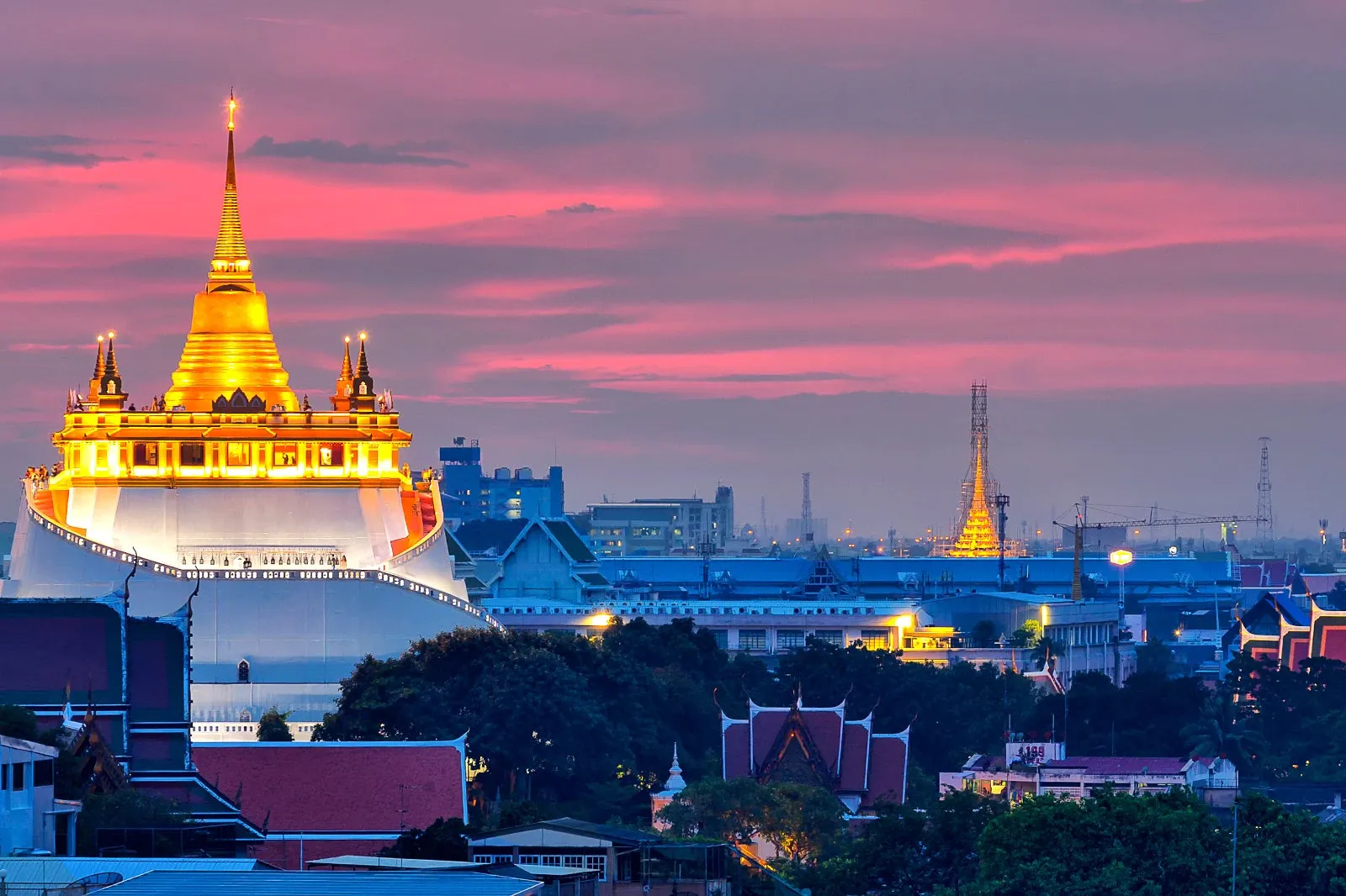 The night view and city skyline of Bangkok, overviewing mystical temples
