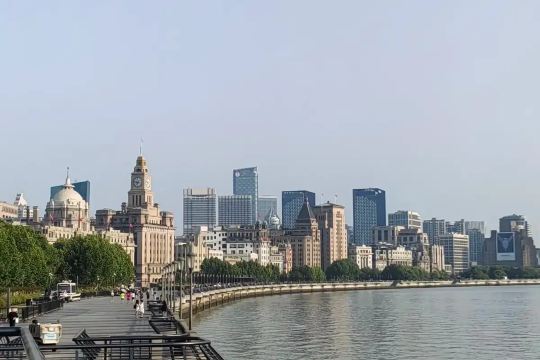 Shanghai’s Bund waterfront promenade lined with historic buildings and modern skyscrapers