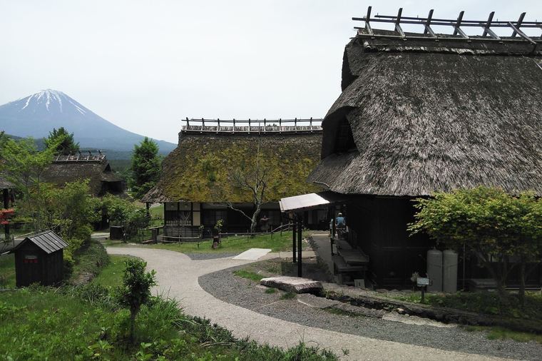 Saiko Iyashi-no-Sato Nenba with traditional thatched-roof houses and Mount Fuji
