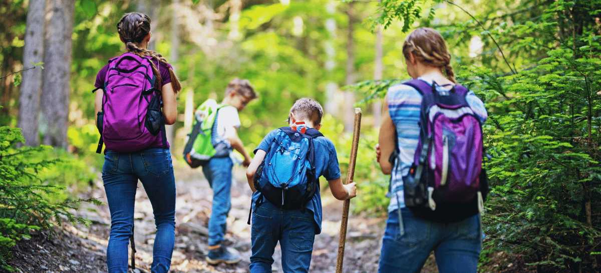 Family hiking along a mountain trail