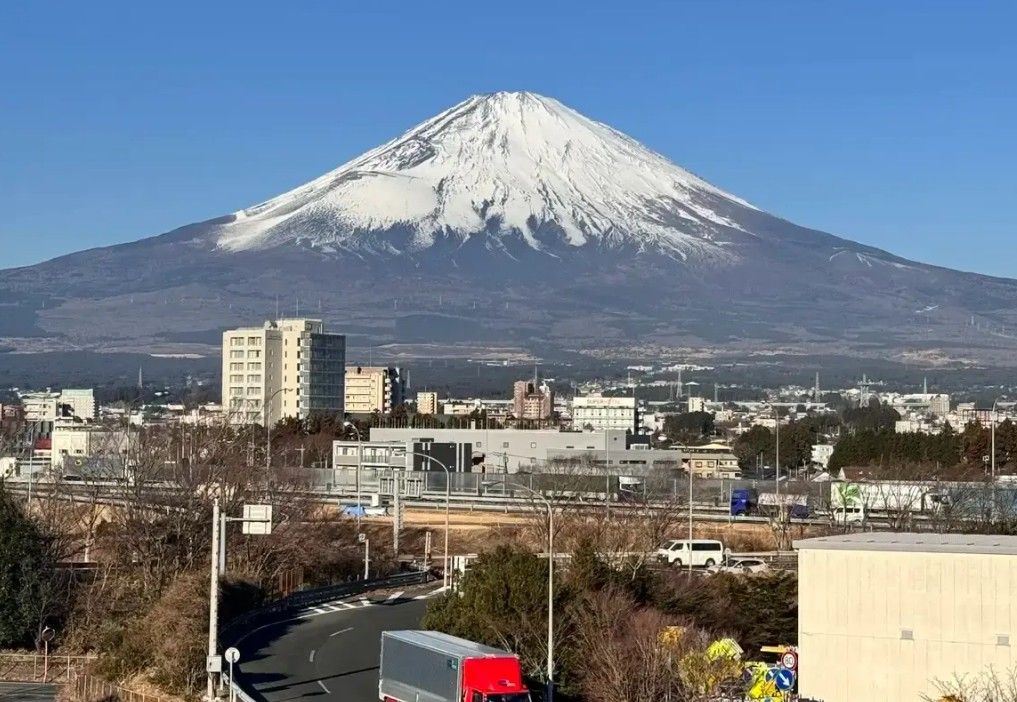 Street view leading toward majestic Mount Fuji in Fujiyoshida