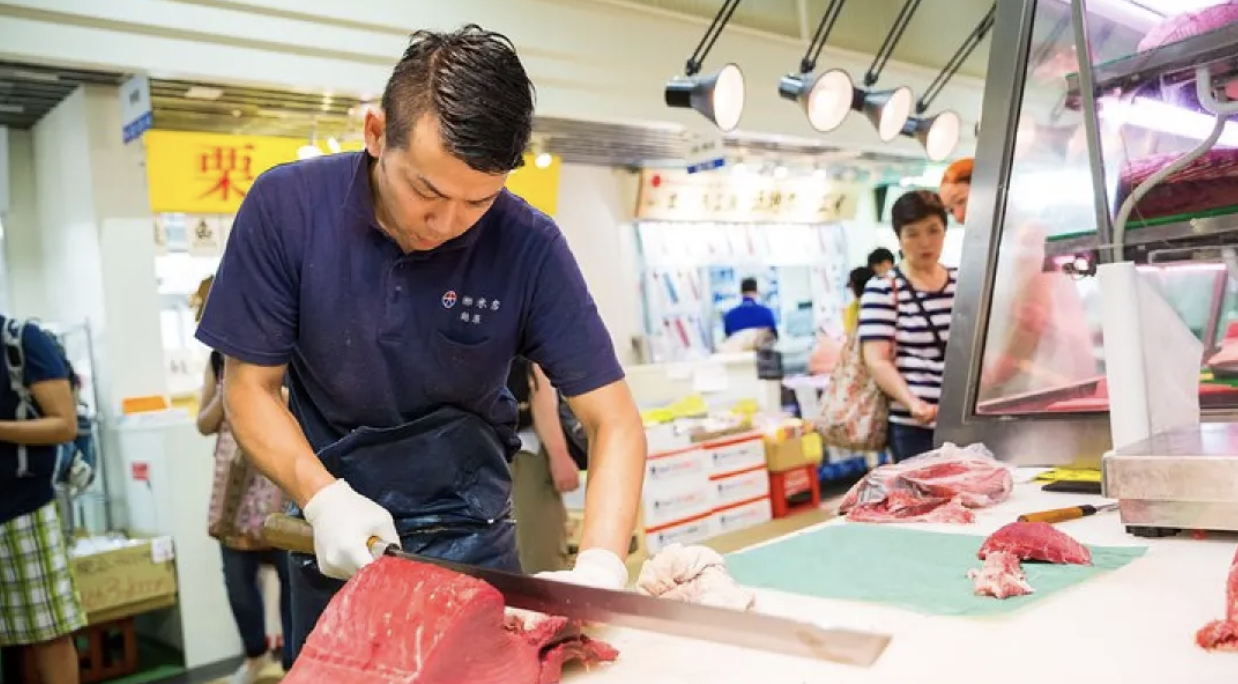 fish monger at Tsukiji Outer Market