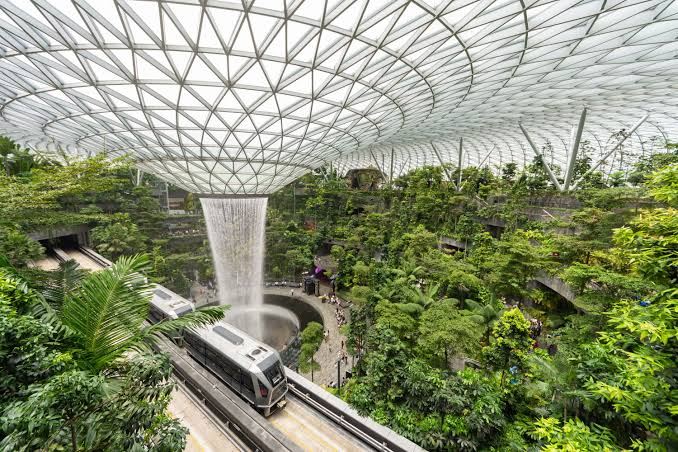 HSBC Rain Vortex waterfall and elevated Skytrain at Jewel Changi Airport
