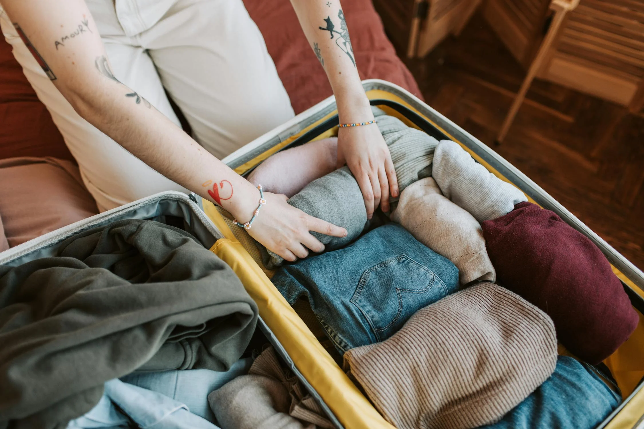 A lady packing her luggage