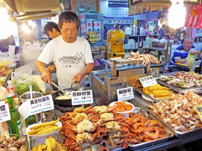 A street vendor selling all sorts of food