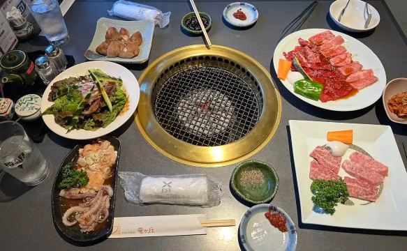 Japanese yakiniku meal with grilled meats and side dishes near Lake Kawaguchi