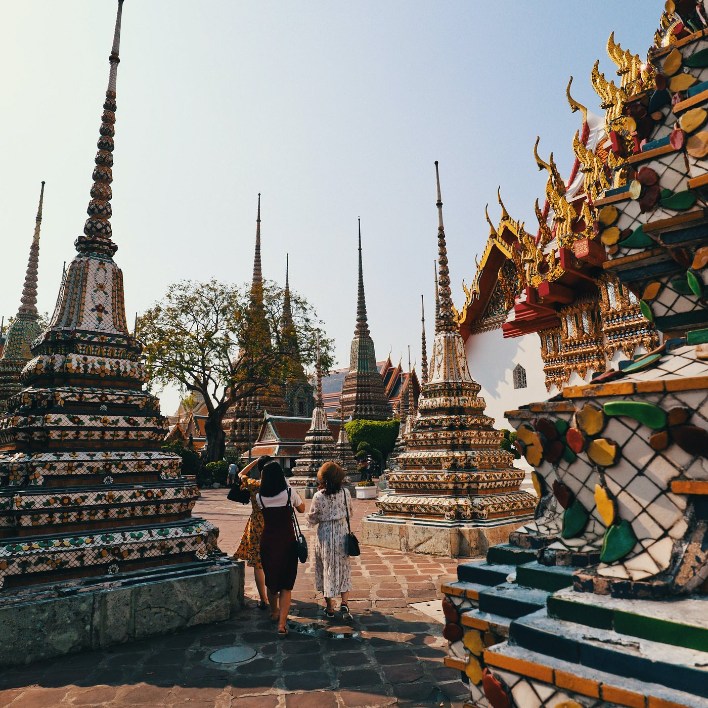 Tourist walking through the Bangkok temple architecture